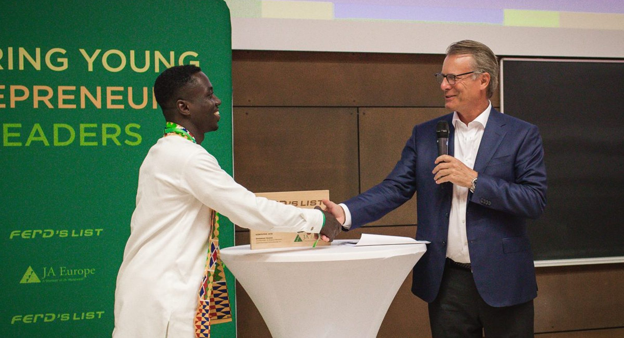 Emmanuel receiving the FERD's List honour from JA Europe and FERD